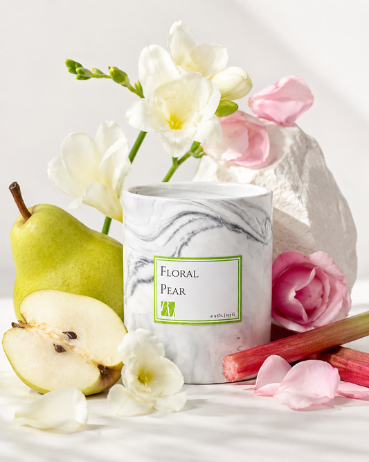 Floral Pear Soy Wax Candle styled with sliced pear, apple blossoms and rhubarb