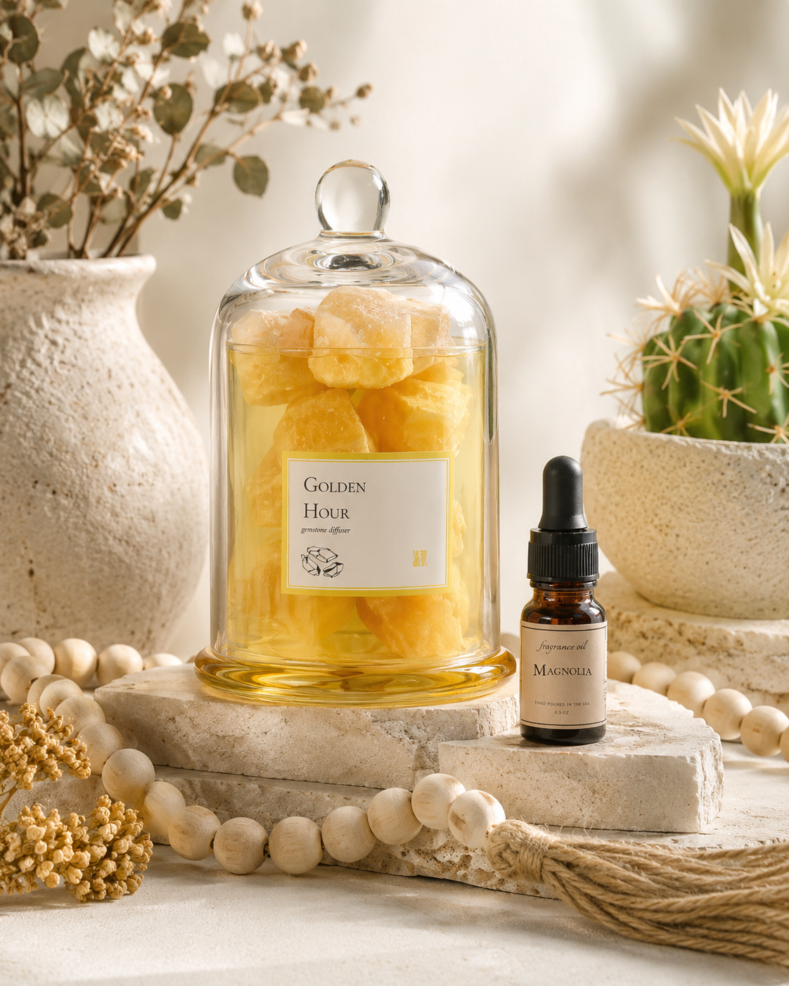 Golden Hour Gemstone Diffuser with amber gemstones under glass cloche